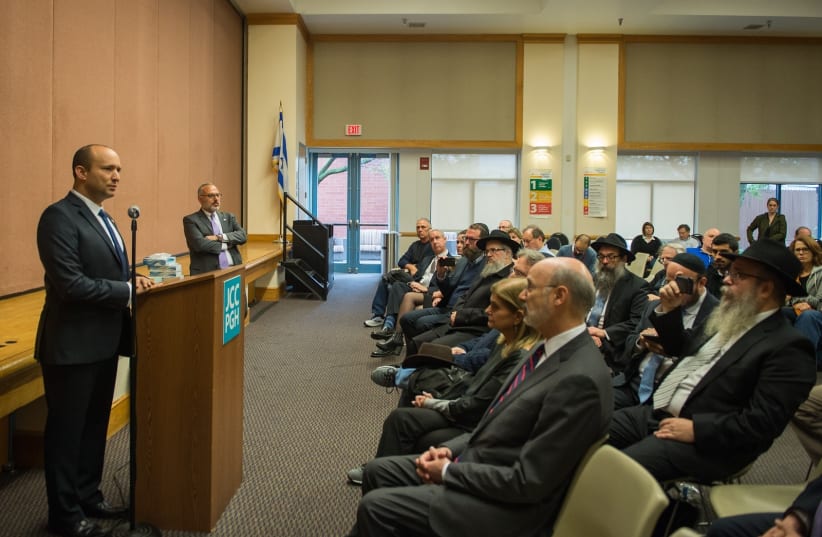  Minister Bennett addresses Pittsburgh Jewish community leaders at a memorial vigil on Sunday, October 28, 2018. (photo credit: ALEXI ROSENFELD)