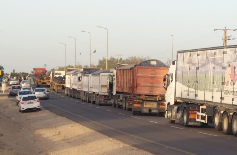 Activists block dozens of trucks from delivering supplies into Gaza. (photo credit: IM TIRTZU)