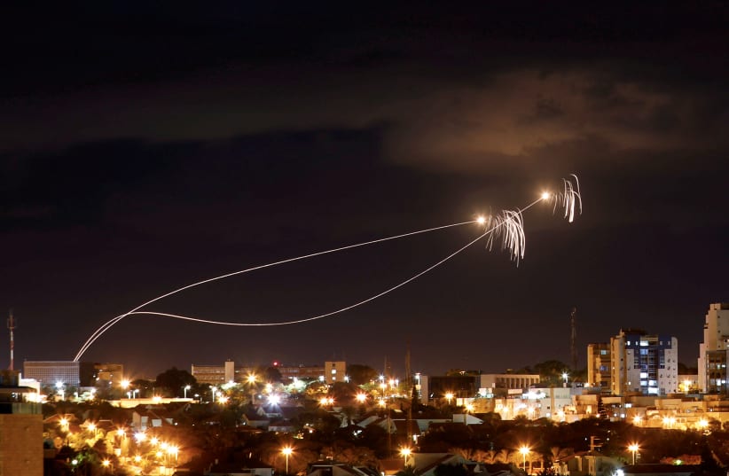 Iron Dome anti-missile system fires interception missiles as rockets are launched from Gaza towards Israel as seen from the city of Ashkelon, Israel October 27, 2018. Picture taken with long exposure (photo credit: AMIR COHEN/REUTERS)