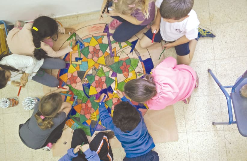 CREATIVE PEACE-MAKING projects like this one supported by the Jewish Federations, help children make a positive connection to their community and build resilience (photo credit: Courtesy)