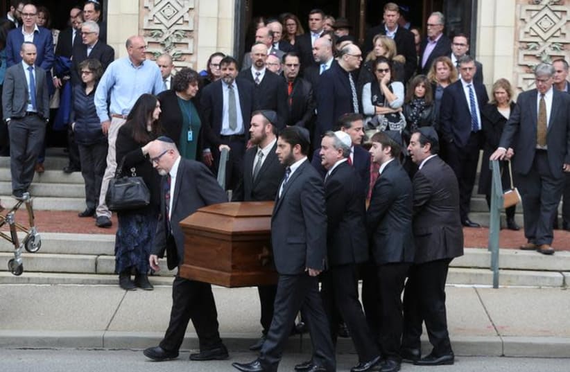 A casket is carried from Rodef Shalom Temple after funeral services for brothers Cecil and David Rosenthal, victims of the Tree of Life Synagogue shooting, in Pittsburgh, Pennsylvania, U.S., October 30, 2018 (photo credit: CATHAL MCNAUGHTON/REUTERS)