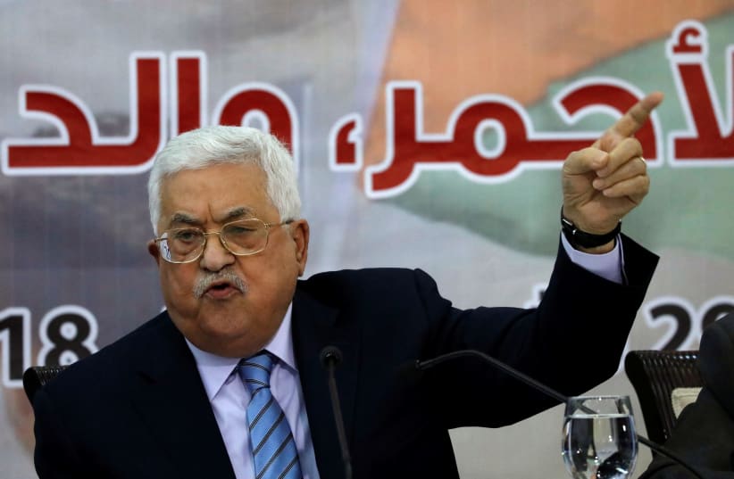 Palestinian President Mahmoud Abbas gestures as he speaks during the meeting of the Central Council of the Palestinian Liberation Organization (PLO) in Ramallah, October 28, 2018 (photo credit: MOHAMAD TOROKMAN/REUTERS)