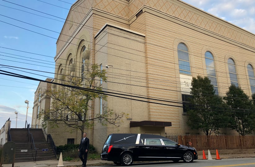 A hearse is parked outside the Beth Shalom Synagogue, where a funeral will be held for Joyce Feinberg. (photo credit: REUTERS/JESSICA RESNICK-AULT)