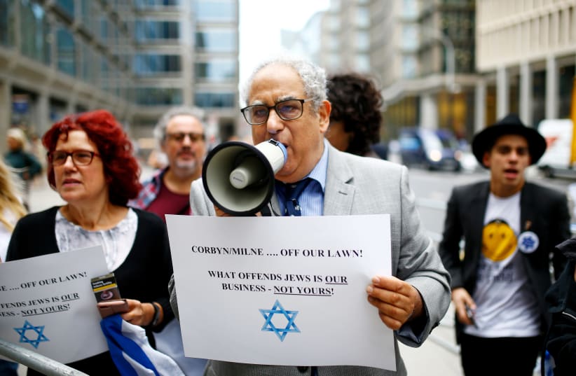 Demonstrators take part in protests outside a meeting of the National Executive of Britain's Labour Party which discussed the party's definition of antisemitism, in London, Britain, September 4, 2018 (photo credit: REUTERS)