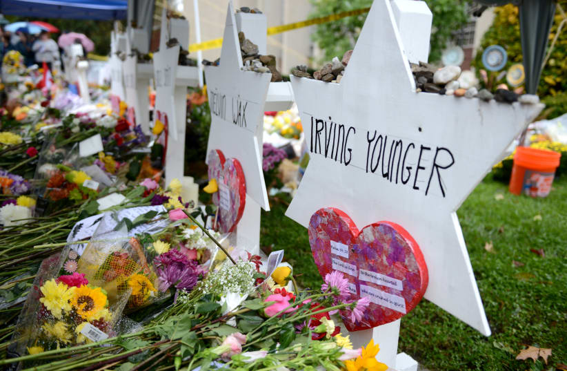 Flowers and other items have been left as memorials outside the Tree of Life synagogue following last Saturday's shooting in Pittsburgh, Pennsylvania, November 3, 2018 (photo credit: ALAN FREED/REUTERS)