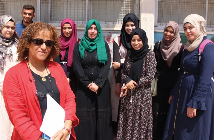 ORT Kseifa Abu Rabe’a’s high school English teacher and English coordinator, Dr. Maha Alawdat, and some of her five-point English matriculation students (photo credit: JUDITH SUDILOVSKY)