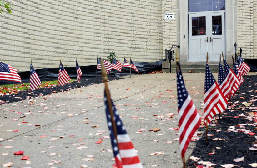 U.S. flags line a path during mid-term elections at a polling station in the Mount Lebanon district in Pittsburgh, Pennsylvania, U.S. November 6, 2018 (photo credit: FEDERICA VALABREGA)