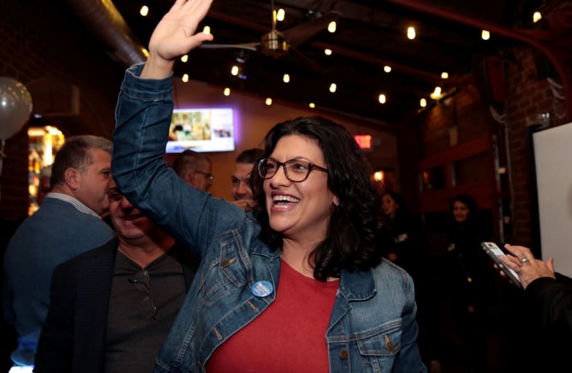 Democratic U.S. congressional candidate Rashida Tlaib reacts after appearing at her midterm election night  (photo credit: REUTERS/REBECCA COOK)
