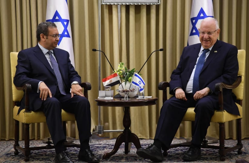 President Rivlin sits with Egyptian ambassador Khaled Azmi (photo credit: HAIM ZACH/GPO)