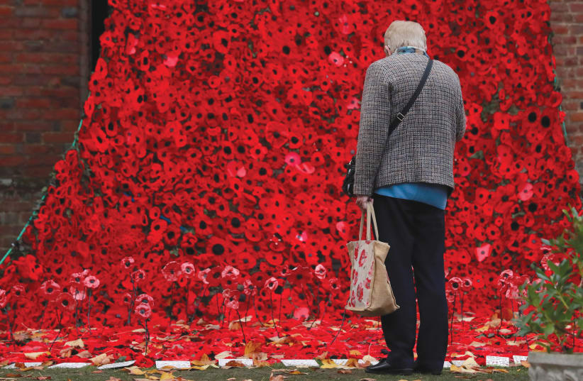 MORE THAN 15,000 poppies, handmade by local craft groups, schools and care homes, are displayed at Hertford Castle in Britain this week to mark the centenary of the end of the First World War (photo credit: ANDREW COULDRIDGE/REUTERS)