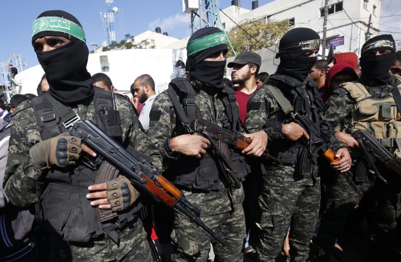 Palestinian militants of the Islamist movement Hamas' military wing Al-Qassam Brigades (photo credit: SAID KHATIB / AFP)