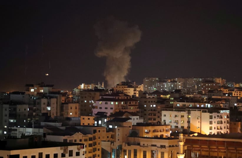 Smoke rises following an Israeli air strike in Gaza November 12, 2018 (photo credit: REUTERS/SUHAIB SALEM)