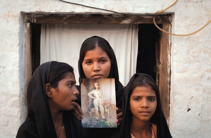 THE DAUGHTERS of Asia Bibi, a Christian woman who has been persecuted by Pakistan’s extremist far-right religious Islamic laws in a country dominated by mobs that preach hate (photo credit: REUTERS)