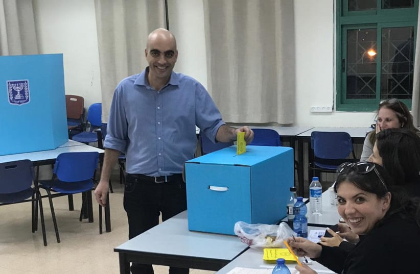 Candidate Ofer Cohen voting in Kfar Vradim. (photo credit: Courtesy)