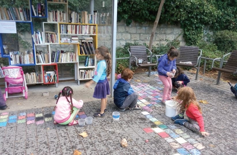 Taking part in the annual ‘chalk festival’ along Mesila Park. (photo credit: EFRAT CAMPAGNANO)