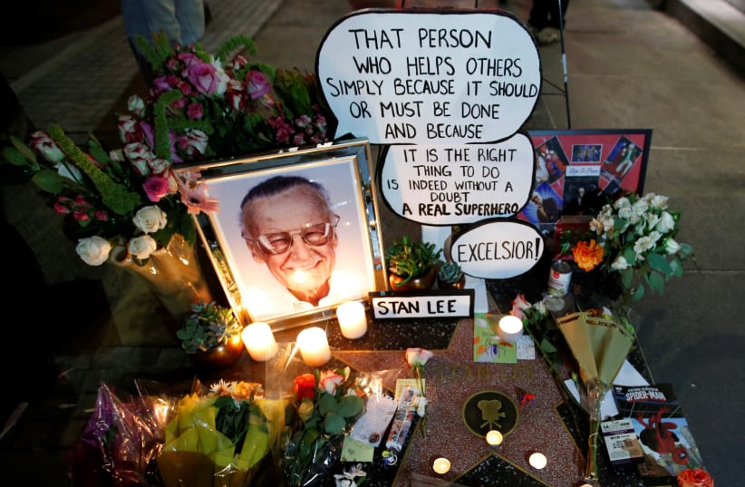 Flowers and mementos are pictured on the star of late Marvel Comics co-creator Stan Lee on the Hollywood Walk of Fame in Los Angeles, California, U.S., November 12, 2018.  (photo credit: MARIO ANZUONI/REUTERS)