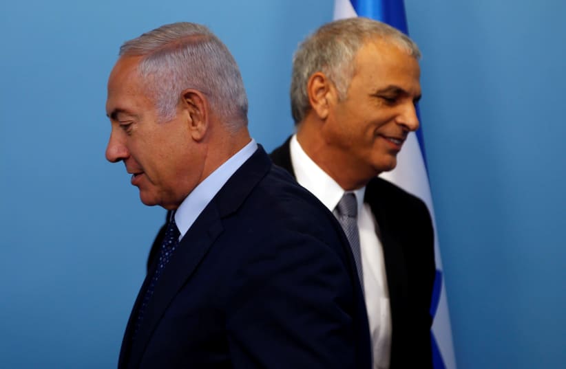 Israeli Prime Minister Benjamin Netanyahu and his Finance Minister Moshe Kahlon attend a news conference announcing the appointment of the new Bank of Israel Governor, in Jerusalem, October 9, 2018 (photo credit: RONEN ZVULUN/REUTERS)