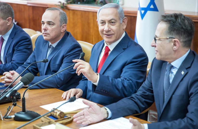 Prime Minister Benjamin Netanyahu at a weekly cabinet meeting, November 18, 2018 (photo credit: EMIL SALMAN/POOL)