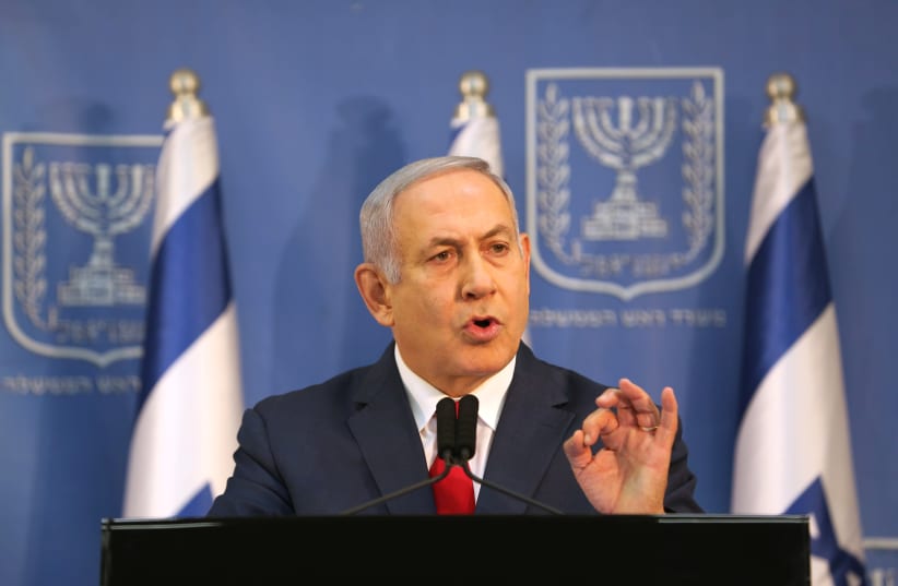 Israel's Prime Minister Benjamin Netanyahu delivers a statement to the members of the media in Tel Aviv, Israel November 18, 2018. (photo credit: REUTERS/CORINNA KERN)