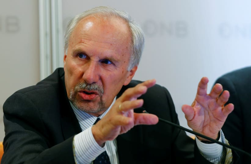 European Central Bank (ECB) Governing Council member and OeNB governor Ewald Nowotny addresses a news conference in Vienna, Austria, June 9, 2017.  (photo credit: REUTERS/LEONHARD FOEGER)