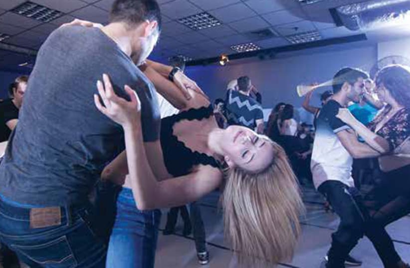 FALLING IN love with the dance: Learning the Latin dance Bachata. (photo credit: ASSAF BELLILI)