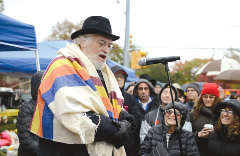Rabbi Chuck Diamond leads a vigil outside the Tree of Life synagogue on November 3 (photo credit: ALAN FREED/REUTERS)