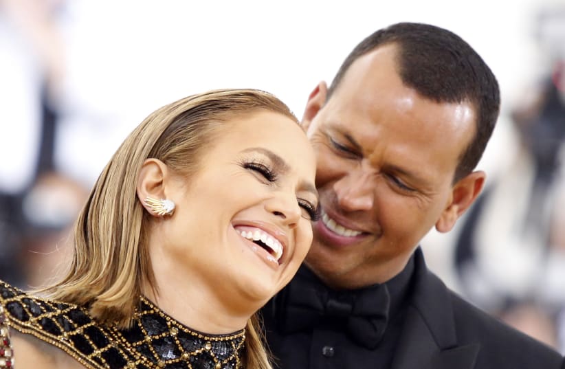 Singer Jennifer Lopez and baseball personality Alex Rodriguez arrive at the Metropolitan Museum of Art Costume Institute Gala (Met Gala) to celebrate the opening of “Heavenly Bodies: Fashion and the Catholic Imagination” in the Manhattan borough of New York, U.S., May 7, 2018.  (photo credit: REUTERS/EDUARDO MUNOZ)