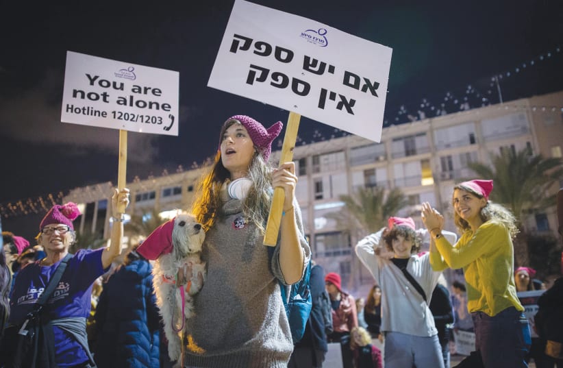 Demonstrators in Tel Aviv protest violence against women at a rally last night, marking the International Day for the Elimination of Violence against Women.  (photo credit: MIRIAM ALSTER/FLASH90)