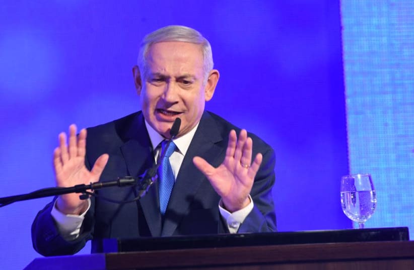 Prime Minister Benjamin Netanyahu speaks at a Likud Hannukah candle lighting, December 2, 2018 (photo credit: AVSHALOM SASSONI/ MAARIV)