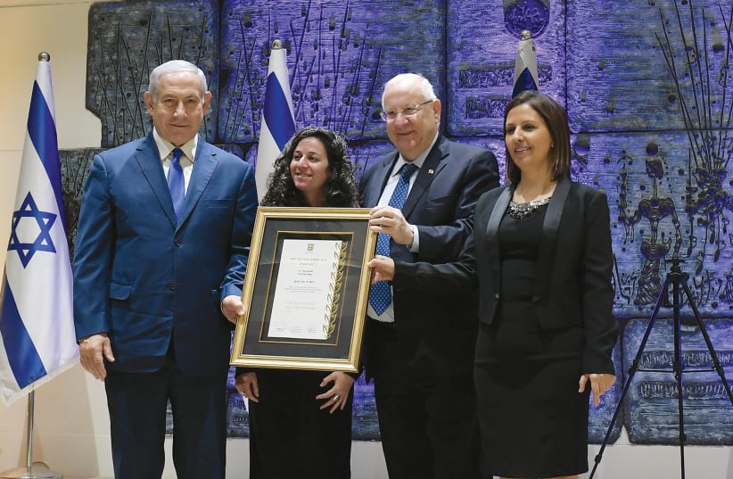 President Reuven Rivlin, Prime Minister Benjamin Netanyahu and Social Equality Minister Gila Gamliel spoke at an awards ceremony at the President’s Residence in recognition of the dedication and devotion of the National Center for the Treatment of Survivors of Human Trafficking  (photo credit: AMOS BEN GERSHOM, GPO)