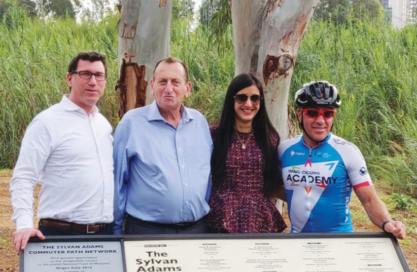 Tel Aviv Mayor Ron Huldai (second from left) and Canadian-Israeli philanthropist Sylvan Adams (right) inaugurated the first section of a 110-kilometer network of bicycle trails that will turn Tel Aviv into the Amsterdam of the Middle East on December 2, 2018 (photo credit: Courtesy)