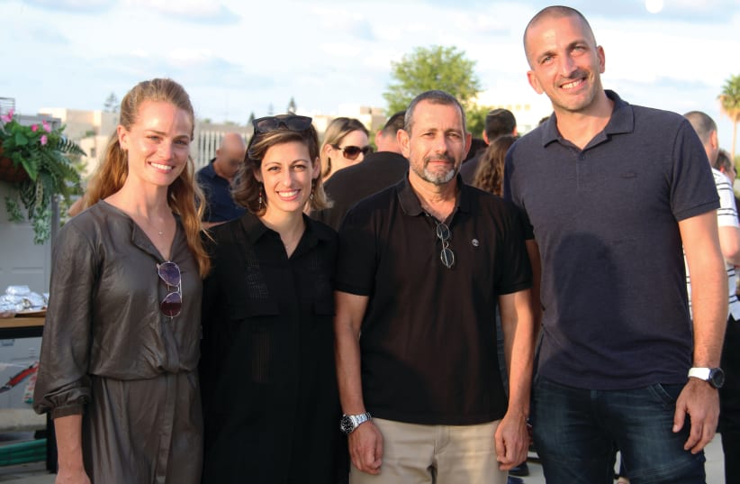 Shin Bet director Nadav Argaman (second from right) with TAU Ventures managing PArtner Nimrod Cohen (right) and company staff  (photo credit: EYLON YEHIEL)