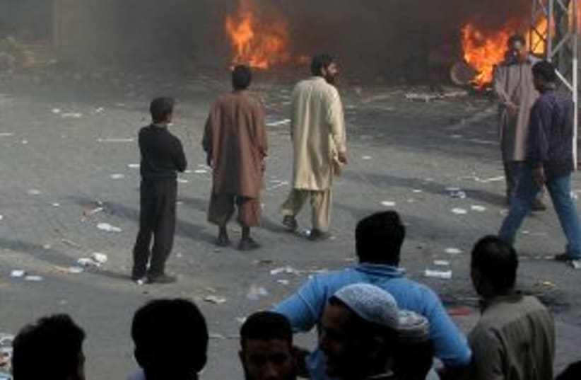 pakistan McD burning 298 (photo credit: AP)