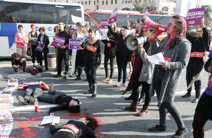 Women block the entrance to the city at the David's Harp Bridge in  Jerusalem as they protest against violence against women, following  the murders of two young women in the past week, in Jerusalem, on  December 4, 2018 (photo credit: MARC ISRAEL SELLEM/THE JERUSALEM POST)