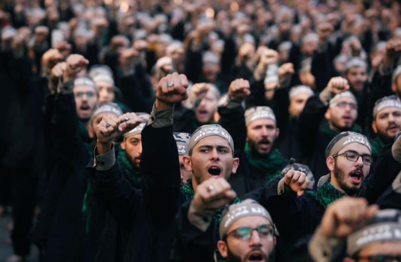 Lebanon's Hezbollah supporters chant slogans during last day of Ashura, in Beirut, Lebanon September 20, 2018 (photo credit: AZIZ TAHER/REUTERS)