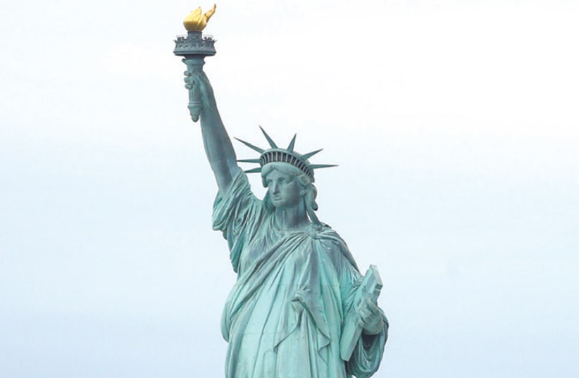The Statue of Liberty in New York Harbor (photo credit: BRENDAN MCDERMID/REUTERS)