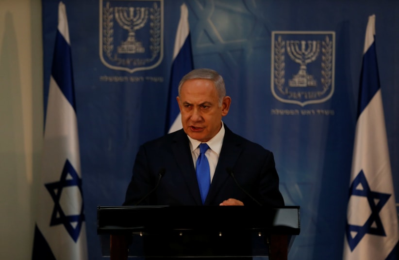 Israeli Prime Minister Benjamin Netanyahu delivers a statement to the media at the Defence Ministry in Tel Aviv, Israel December 4, 2018 (photo credit: AMMAR AWAD / REUTERS)