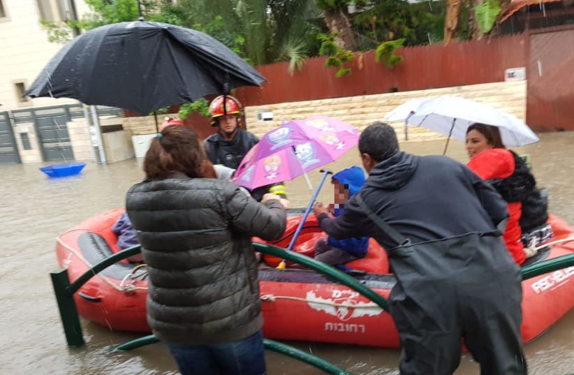 Children are rescued from a flooded kindergarden in Rehovot on December 6, 2018 (photo credit: REHOVOT RESCUE SERVICES SPOKESPERSON)