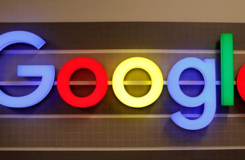 An illuminated Google logo is seen inside an office building in Zurich, Switzerland December 5, 2018. (photo credit: REUTERS/ARND WIEGMANN)