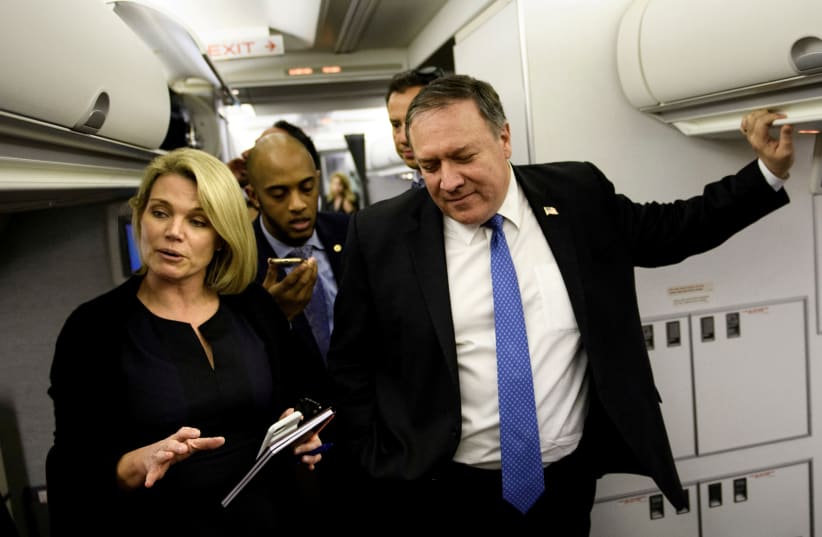 Spokesperson Heather Nauert (L) speaks as U.S. Secretary of State Mike Pompeo dialogues with reporters in his plane while flying from Panama to Mexico, October 18, 2018 (photo credit: BRENDAN SMIALOWSKI/POOL VIA REUTERS)