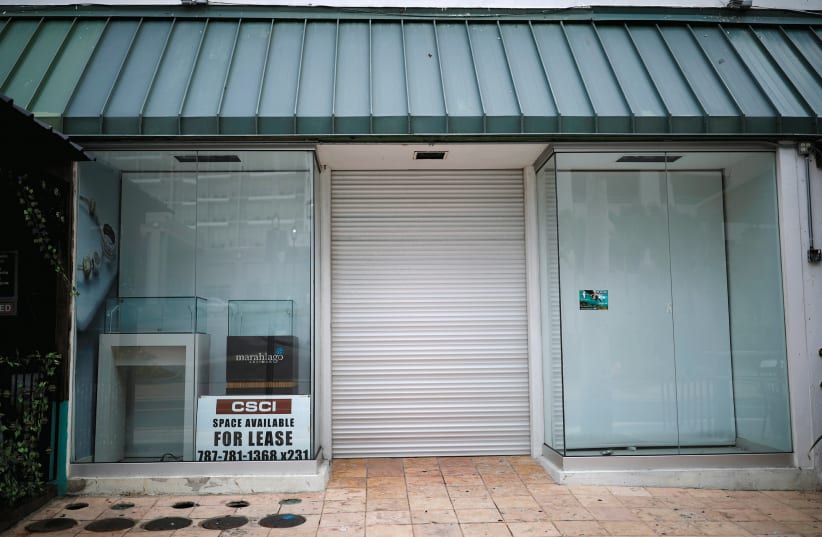 A closed store in San Juan, Puerto Rico (photo credit: REUTERS)