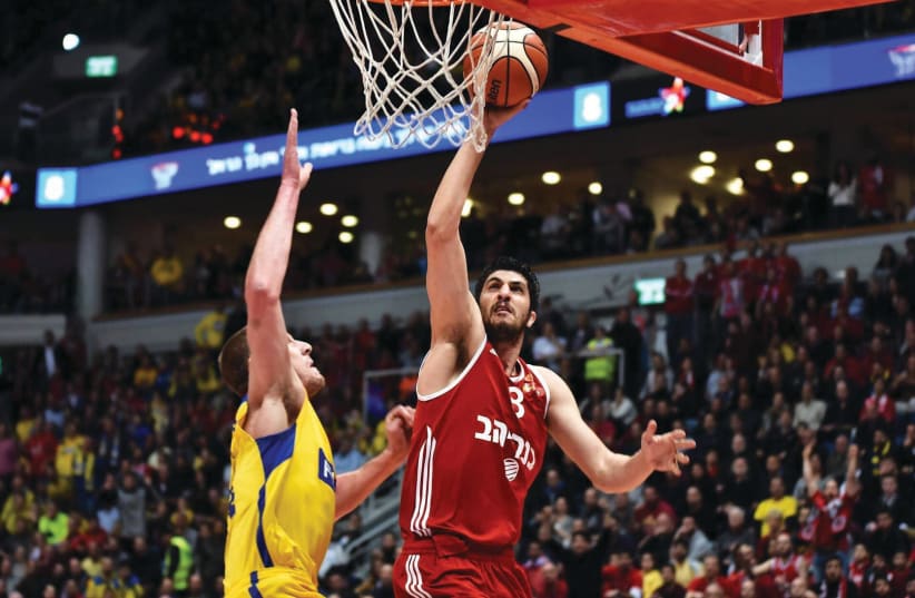 SPARKS ALWAYS fly when Lior Eliyahu (right) and Hapoel Jerusalem duel with Eliyahu's former team, Maccabi Tel Aviv. The two most preeminent Israeli clubs will face each other on Saturday night in Basketball Super Leahue action. (photo credit: DOV HALICKMAN/COURTESY)