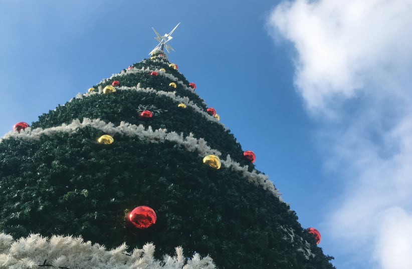 A CHRISTMAS TREE stands at Mar Elias Church for the Christmas-Suta festival  (photo credit: YVETTE J. DEANE)