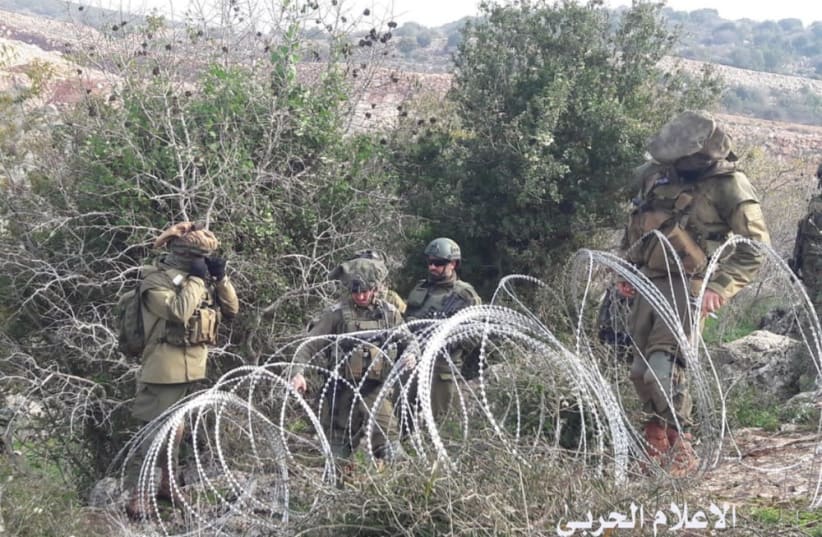 Israeli soldiers set up barbed wire before a confrontation broke out between IDF and Lebanese armed forces (photo credit: HEZBOLLAH TELEGRAM CHANNEL AND AL-MANAR)