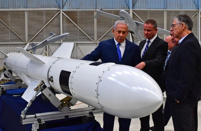 Prime Minister Benjamin Netanyahu inspects a missile at Israel Aerospace Industries. (photo credit: KOBI GIDEON/GPO)