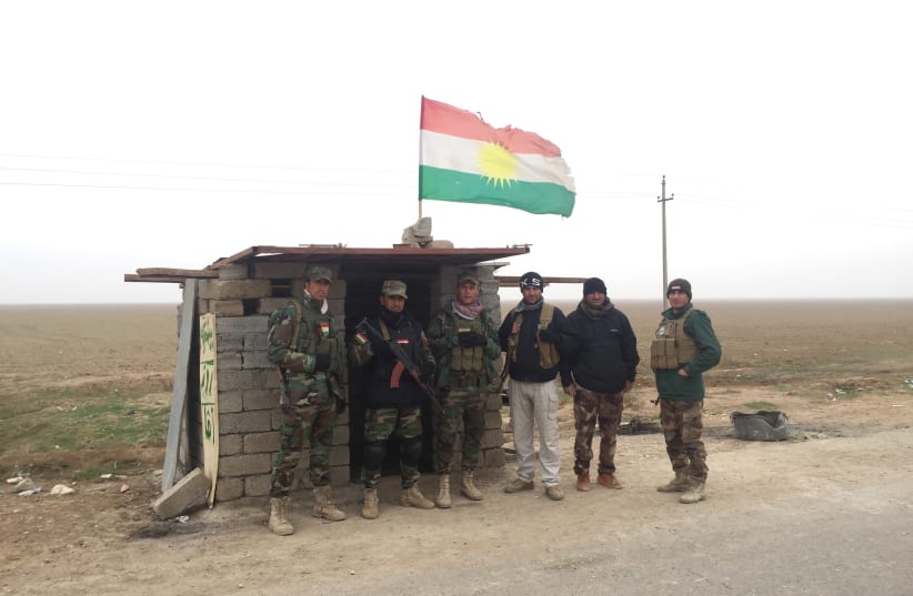 Rojava Peshmerga guard a road in northern Iraq in December 2015 (photo credit: SETH J. FRANTZMAN)