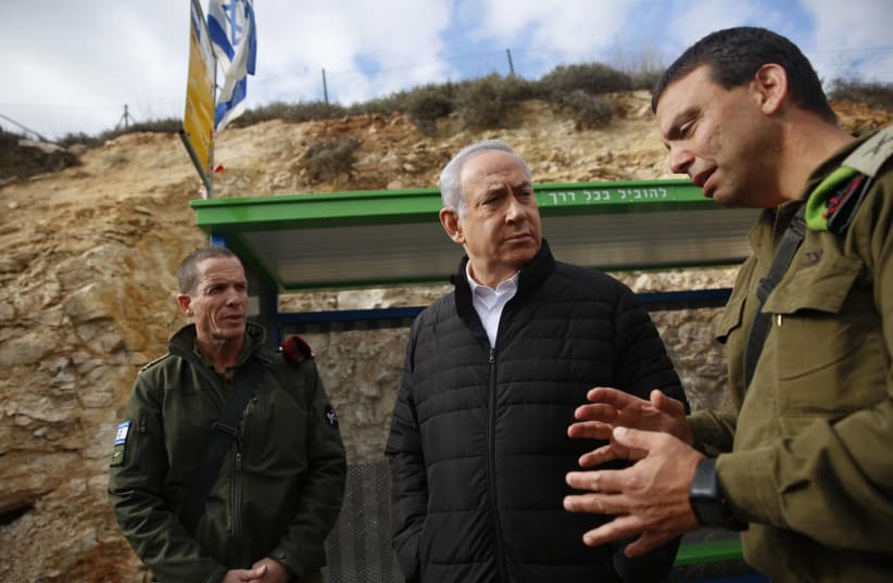 Prime Minister Benjamin Netanyahu at the site of terror attack near Bet El, December 18, 2018 (photo credit: TOMER APPELBAUM)
