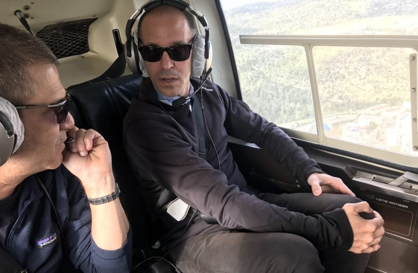 Airbnb Vice-President Chris Lanahan on a helicopter tour of the West Bank, December 18, 2018 (photo credit: COURTESY THE ISRAELI PROJECT)