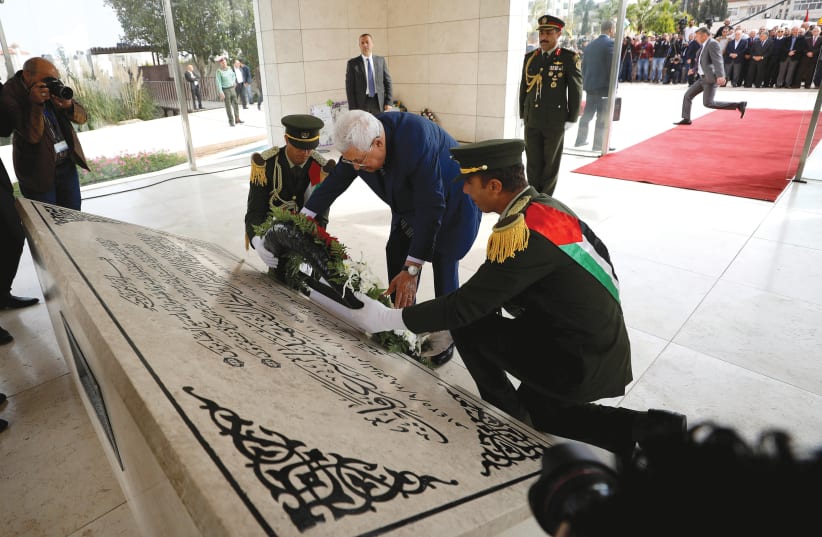 PALESTINIAN AUTHORITY President Mahmoud Abbas lays a wreath on the tomb of late Palestinian leader Yasser Arafat. (photo credit: REUTERS)