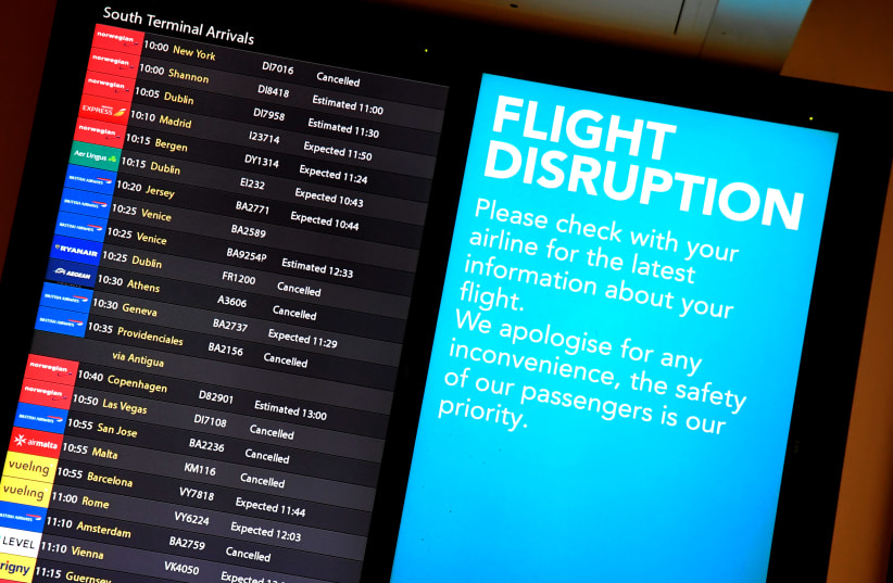 An arrivals board in the South Terminal building at Gatwick Airport, after the airport reopened to flights following its forced closure because of drone activity, in Gatwick, Britain, December 21, 2018 (photo credit: TOBY MELVILLE/REUTERS)